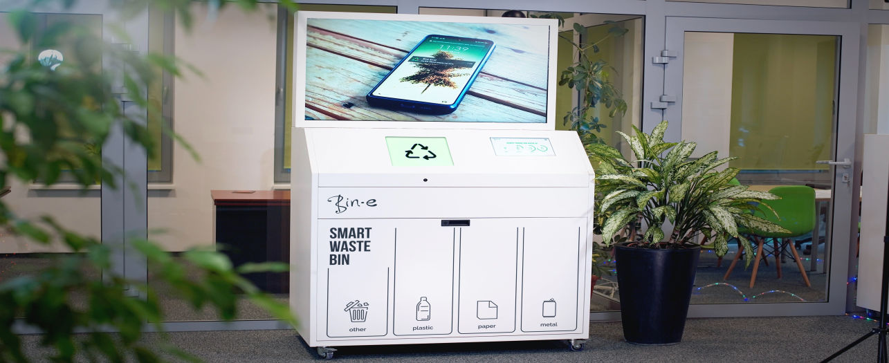 Smart waste bin with labeled compartments for recycling, featuring a digital screen displaying - POWER Bear