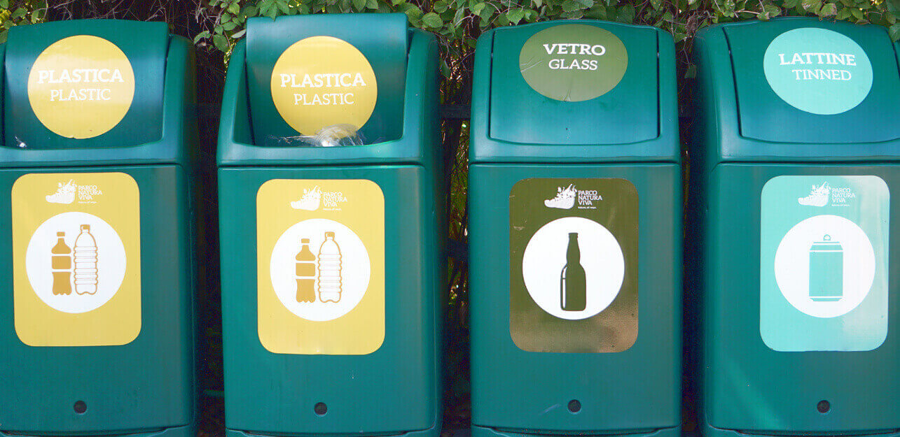Waste management signs on trash bin