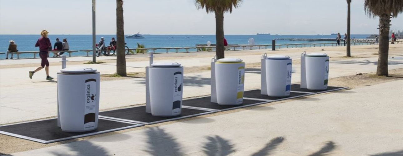 Row of underground bins near a beach 